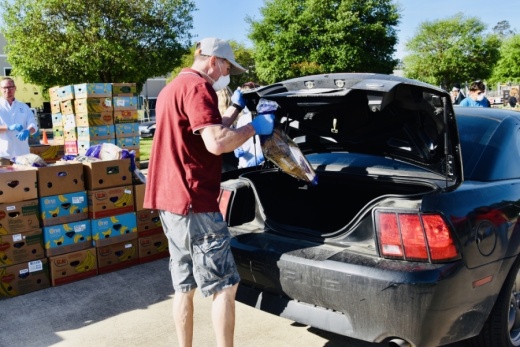 Volunteers unload food donations for the Montgomery County Food Bank. (Courtesy Drive West Communications)