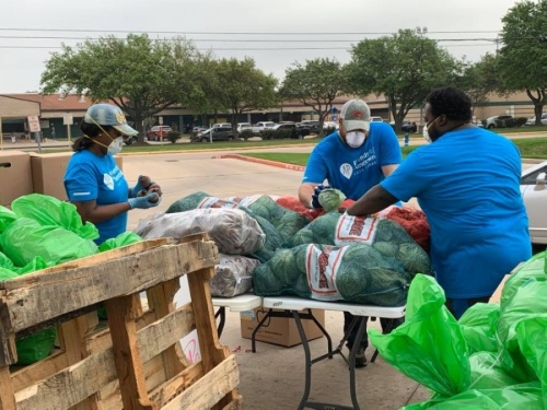 Volunteers help Friends of Sundown, a local chapter of Attack on Poverty, pack food from the Houston Food Bank to distribute Katy-area residents on March 25. (Courtesy Friends of Sundown)