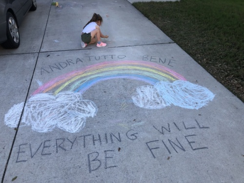 Emilia Shively draws a rainbow to inspire those who walk on her street. (Courtesy Tina Shively)