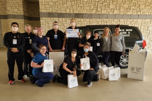 Medical professionals from Baylor Scott & White Medical Center-Centennial in Frisco received a donation of masks and assorted goodies from Two Men and A Truck on April 3. (Courtesy Two Men and A Truck)