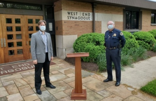 Rabbi Joshua Kullock and Metro Nashville Police Chief Steve Anderson participated in a Passover tradition April 8 while practicing social distancing guidelines. (Courtesy Metro Nashville)