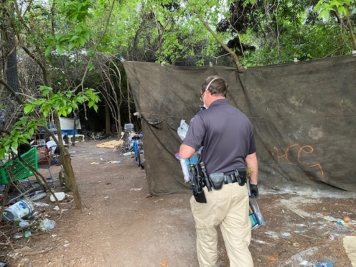 The Harris County Homeless Outreach Team is providing homeless individuals with hand sanitizer, face masks and information sheets on the coronavirus. (Courtesy Harris County Sheriff's Office)