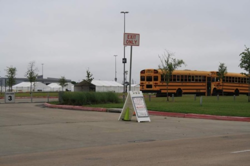 Katy ISD buses line the Legacy Stadium parking lot where patients can get tested for the coronavirus. (Jen Para/Community Impact Newspaper)
