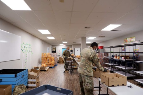 On Wednesday, April 22, members from the U.S. National Guard reported to assist food unboxing and distributions at Bridging for Tomorrow's food pantry, doubling the nonprofit's staff for the day. (Courtesy Bridging for Tomorrow)