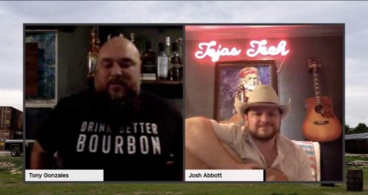 A screen shot of Treaty Oak representative Tony Gonzales and Josh Abbott hold a guitar