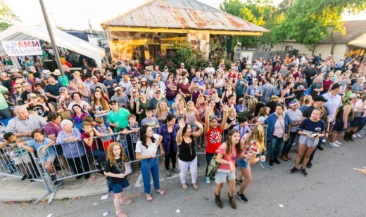 A photo of a gathered crowd on Mercer Street in Dripping Springs