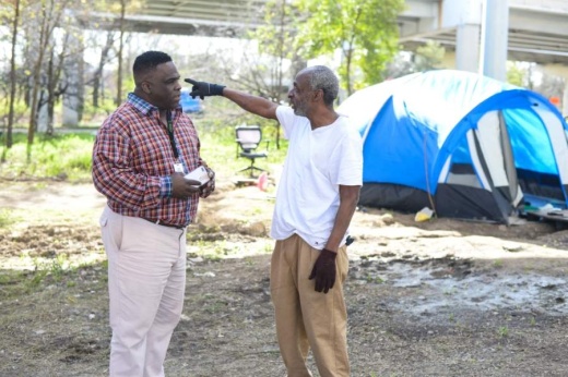 SEARCH outreach specialist Otha Norton, left, assists Carlton Ray and records data in a multi-agency information system for tracking Houston's homeless population. (Courtesy Lauren Anderson)