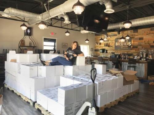 Two Brothers Winery co-owner Donna Kirkwood moved inventory out of storage as she shifted to new sales strategies. (Cass Clements/Community Impact Newspaper)