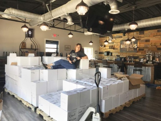 Two Brothers Winery co-owner Donna Kirkwood moved inventory out of storage as she shifted to new sales strategies. (Cass Clements/Community Impact Newspaper)