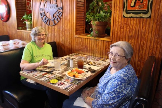 From left to right, Kay Hefner and her mother, Estelle Sanders, are back the first day the doors reopen at Bill Smith's Cafe in McKinney. (Miranda Jaimes/Community Impact Newspaper)