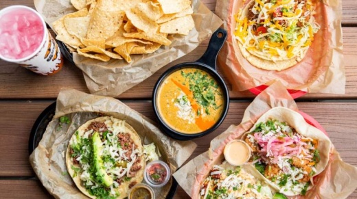 Here are 25 restaurants offering takeout, dine-in services and to-go margaritas to help put you in the festive spirit. (Courtesy Torchy's Tacos)