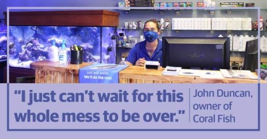 Owner John Duncan sports a protective face mask inside Coral Fish and Beyond, located at 2041 Rufe Snow Drive, Ste. 303, Keller. (Ian Pribanic/Community Impact Newspaper)