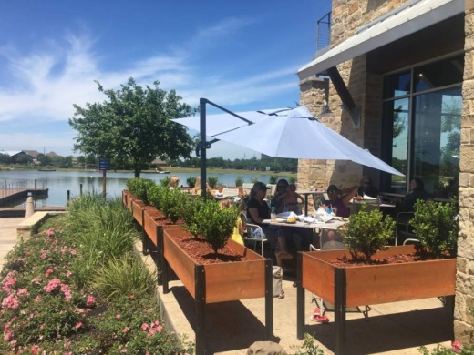 At Ambriza Social Mexican Kitchen, where tables overlook the water at the Boardwalk at Towne Lake, the ability to reopen for dine-in service has been well-received. (Shawn Arrajj/Community Impact Newspaper)