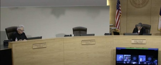 A screen shot of a Travis County Commissioners Court meeting