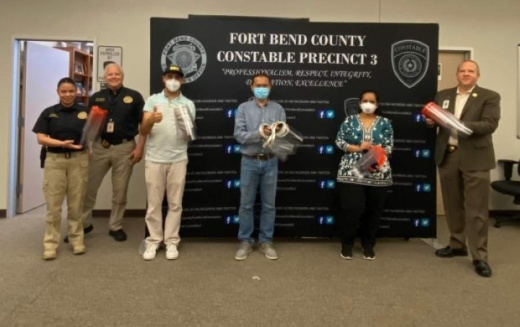 Harmony School of Innovation-Katy and Harmony Science Academy-Sugar Land gave 45 shields to the Fort Bend County Precinct 3 Constable's Office on May 4. (Courtesy Harmony Public Schools)