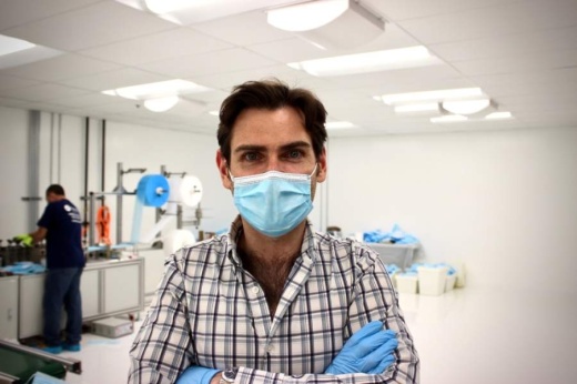 Lloyd Armbrust, founder and CEO of Armbrust American, developed an automated system to produce surgical face masks at a Pflugerville facility. (Taylor Jackson Buchanan/Community Impact Newspaper)