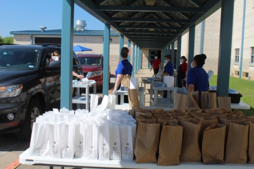 Leander ISD will continue its free food drive-thru program (pictured) at three campuses from June 1-July 31. (Brian Perdue/Community Impact Newspaper)