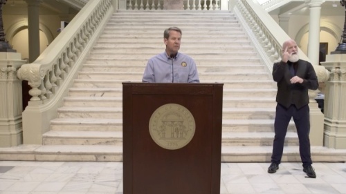 Gov. Brian Kemp announced additional guidelines May 28 for shuttered businesses to reopen as well as for summer camps, professional and amateur sports, bars and nightclubs and amusement parks. (Screenshot via Facebook Live)