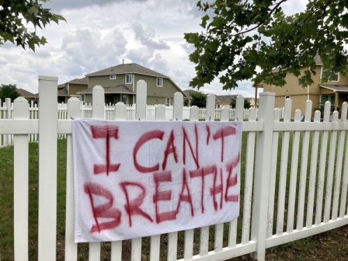 A handmade banner is displayed outside a Round Rock home, referencing some of the final words of George Floyd. Floyd, an unarmed black man, was killed in Minneapolis by then-Officer Derek Chauvin on May 25. (Taylor Jackson Buchanan/Community Impact Newspaper)