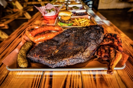 Pictured above is a plate of Chuckwagon BBQ & Burgers' brisket, sausage, jalapeno cheddar sausage, boudin and chicken. (Courtesy Chuckwagon BBQ & Burgers)