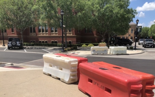 Barricades were in place at Southlake Town Square on June 5 in advance of the protest. (Ana Erwin/Community Impact Newspaper)