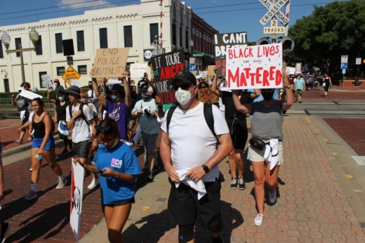 Peaceful protesters marched June 7 through the streets of downtown Plano to protest prominent instances across the country of police violence against black people. (Daniel Houston/Community Impact Newspaper)