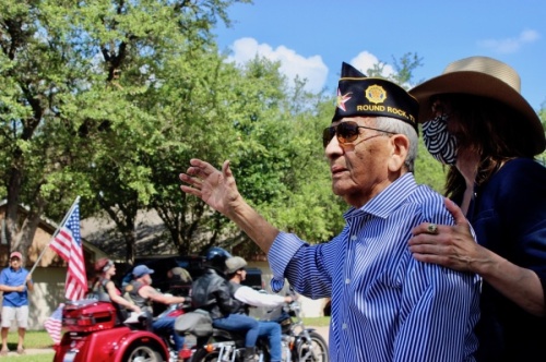 From left: Robert Sanchez is accompanied by his daughter Frances Dee Sanchez during a surprise parade to celebrate his 100th birthday. (Photos by Taylor Jackson Buchanan/Community Impact Newspaper)
