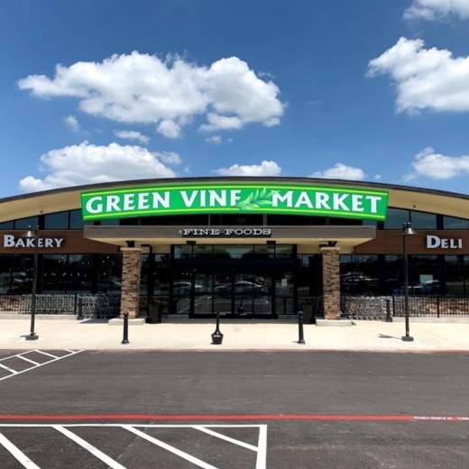 The market offers grocery items including dairy, fresh meat and produce, as well as an artisan bakery, cake section, specialty coffee bar and a service counter to order customized-portion meats. (Courtesy Green Vine Market)