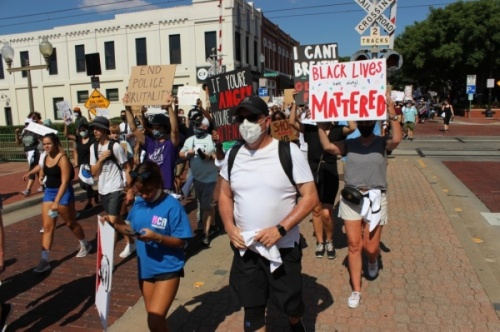 Peaceful protesters marched June 7 through the streets of downtown Plano to protest prominent instances across the country of police violence against black people. (Daniel Houston/Community Impact Newspaper)
