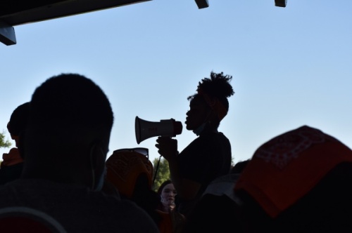 Monique Mitchell, a student at Berkner High School and protest organizer, recounted her own experiences with racism in the district at a June 3 demonstration in Berkner Park. (Makenzie Plusnick/Community Impact Newspaper)