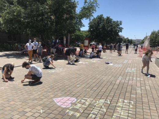 Lake Travis Against Brutality organized a protest at the Hill Country Galleria on June 13. (Amy Rae Dadamo/Community Impact Newspaper)
