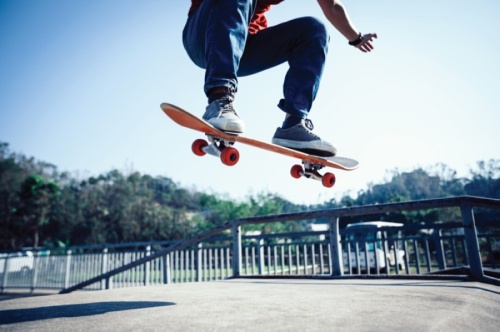 Kid skateboarding on a rail
