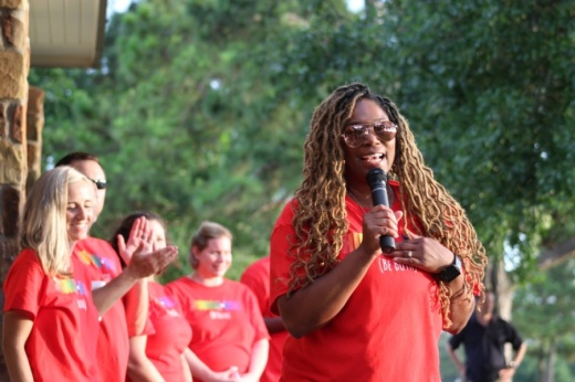 Event organizer and Gleannloch Farms resident Christina Hudson speaks alongside members of her Juneteenth Unity Event committee. (Adriana Rezal/Community Impact Newspaper)
