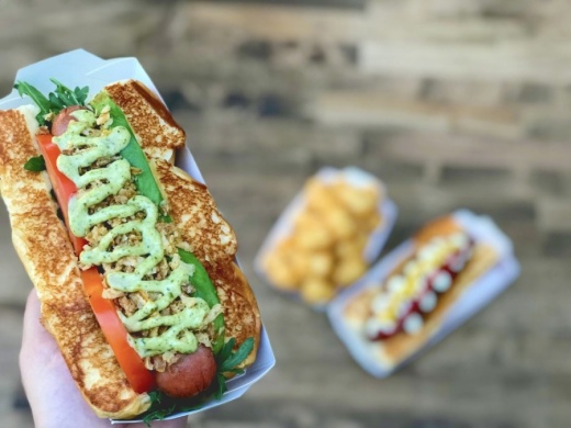 The restaurant specializes in craft hot dogs and will feature a dog-friendly patio, high-definition big screen televisions, and a full bar. (Courtesy Dog Haus Biergarten)