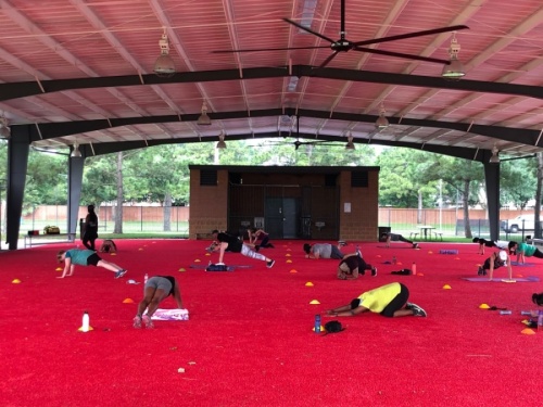 The outdoor pavilion at the Langham Creek Family YMCA has been converted into an open-air studio for group exercise classes, featuring 8,000 square feet of covered turf space outfitted with fitness equipment. (Courtesy YMCA of Greater Houston)