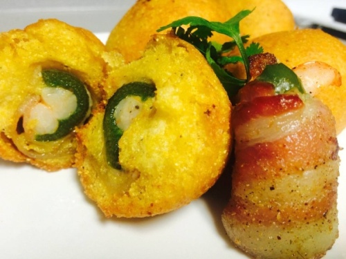 Hushpuppies stuffed with bacon wrapped shrimp and jalapenos are among menu offerings. (Courtesy Kenneth Rector Jr.)