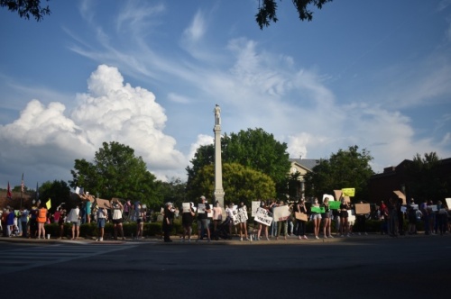 Protesters against racism gather at the base of the Confederate monument in Franklin's downtown on June 13. (Alex Hosey/Community Impact Newspaper)