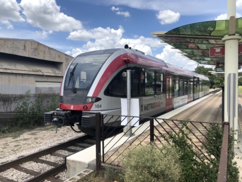 A Red Line MetroRail train moves through the Crestview station on July 22. Capital Metro and the City of Austin are deciding on a framework to send to voters to raise funding for the public transit agency's Project Connect plan. (Jack Flagler/Community Impact Newspaper) 