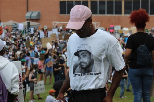 A man shows support for Michael Ramos, an unarmed Black man who was killed April 24 by Austin police, during the June 7 Justice for Them All protest and march. (Christopher Neely/Community Impact Newspaper)