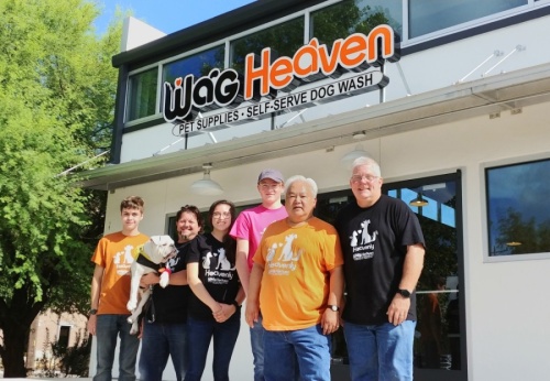 Jeff Manley (far right), Jusak Yang Bernhard (second right) and their staff stand outside the new Wag Heaven location on South Austin Avenue. (Courtesy Wag Heaven)