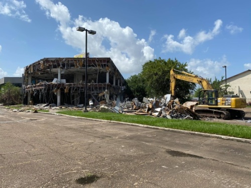 Following several years of complaints from local residents and neighboring business owners, demolition began July 30 on a longtime nuisance building located on FM 1960. (Courtesy Larry Lipton)
