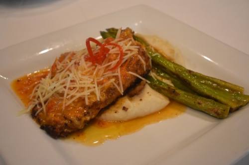 Sun-dried tomato chicken ($23) This dish features Italian crusted chicken cooked in sun-dried tomato lemon butter and topped with Parmesan cheese, with mashed potatoes and asparagus on the side. (Photos by Alex Hosey/Community Impact Newspaper)