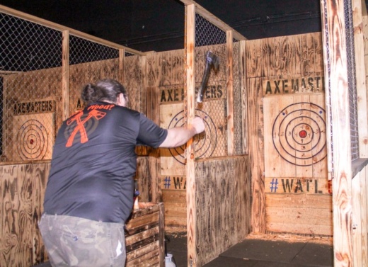 Mark Thomas, one of the Axe Masters coaches, practices his throwing. Thomas said when a thrower first “sticks” the axe in the target, it is rewarding for everyone involved. (Colleen Ferguson/Community Impact Newspaper)