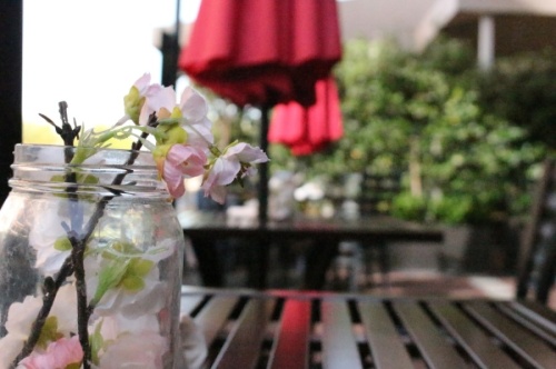 outdoor dining table, umbrella and mason jar