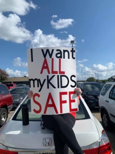 Cy-Fair ISD employees protest with signs in the parking lot outside of the Aug. 10 board meeting. (Courtesy Cy-Fair American Federation of Teachers)