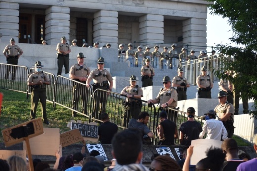 Law enforcement officers and the National Guard blocked the steps leading up to the state capitol June 13. (Alex Hosey/Community Impact Newspaper)