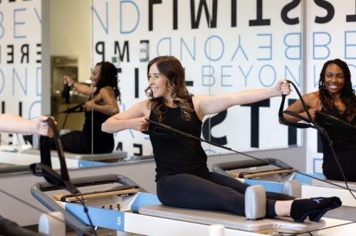 The boutique-style fitness studio will offer music-driven, 50-minute workouts on custom Pilates reformers. (Courtesy BEYOND Pilates)