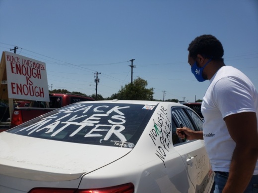 Roy Wood decorated his car for the Pushing for Justice Caravan for Javier Ambler on Aug. 15. (Ali Linan/Community Impact Newspaper)