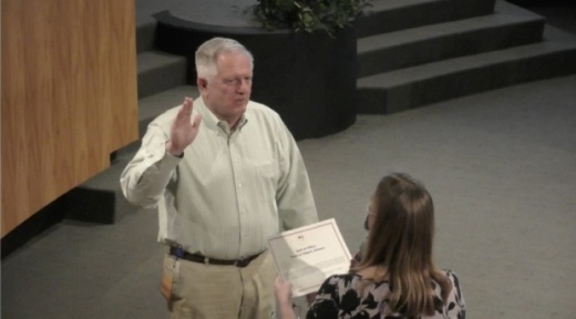 Scott Anderson takes the oath of office as mayor of Gilbert on Aug. 18 from Town Clerk Lisa Maxwell. (Screenshot via Town of Gilbert)