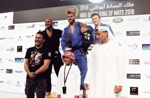 Alexander Hilligsoe Trans (center) is a former jiujitsu fighter who has competed and earned top titles in national and world championships. He will open his first gym, Progresso Jiu Jitsu, in Plano in mid-September. (Courtesy Alexander Hilligsoe Trans)
